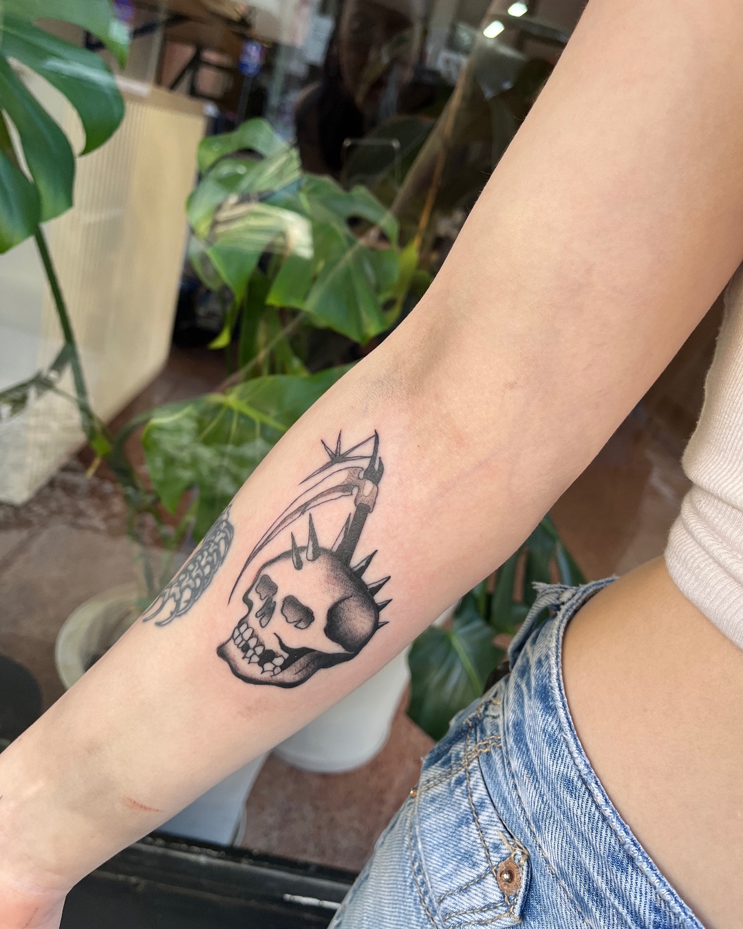 Spiked Skull with Scythe