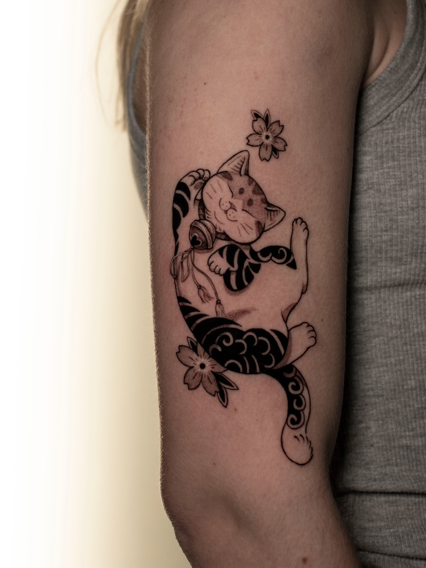Playful Maneki-Neko Kitten with Cherry Blossoms