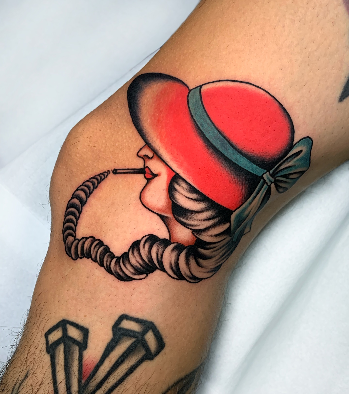 Smoke Rings Under a Red Hat